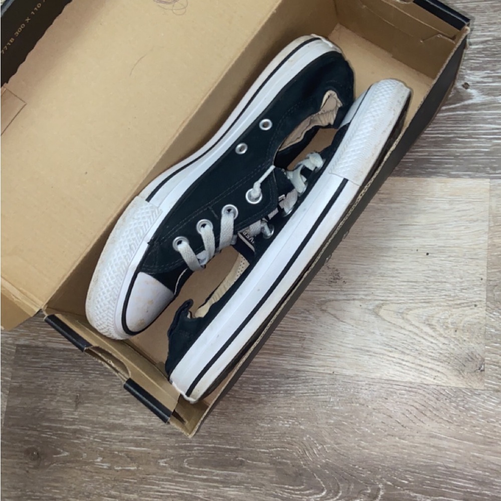 Converse slip ons.